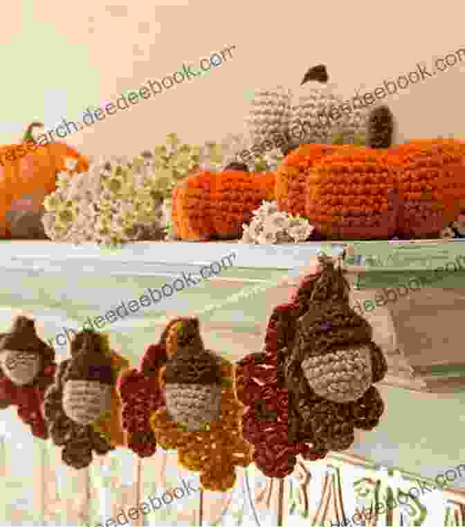 A Crocheted Garland Featuring Pumpkins In Different Sizes And Colors, Strung On A Wire Adorable Halloween Crochet Tutorials: Cute Halloween Patterns And Instructions