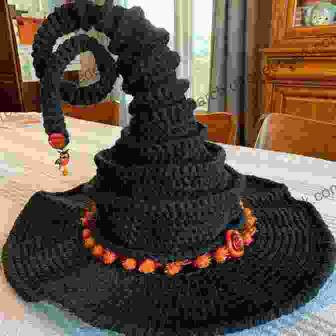 A Crocheted Witch's Hat With A Black Cone Shaped Crown And A Wide Brim Adorable Halloween Crochet Tutorials: Cute Halloween Patterns And Instructions