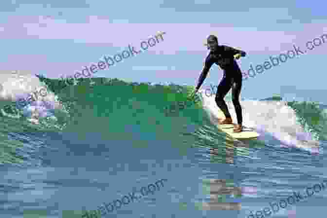 A Surfer Riding A Wave In Maine. Maine Beaches: A Pocket Guide